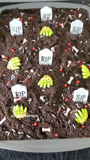 Easy Graveyard Halloween Cake Recipe! This Halloween recipe is perfect for a last minute celebration. All you need is a boxed chocolate cake mix, chocolate frosting, oreo cookie crumbles and Wilton Halloween candies. Just make and bake cake per directions, frost, add cookie crumbles and candy tombstones, zombie hands, bones and sprinkles. #halloweendesserts #halloweencake #halloweenrecipes #easydessert | Everyday Shortcuts by Alison McFadden