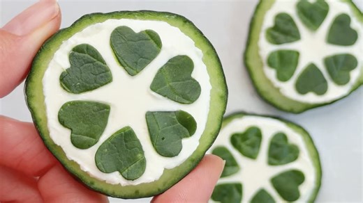 Pretty cucumber canapés with cream cheese & spinach hearts