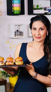 Sliders / Veg Mini Burgers Full of sweet potato fibers, few drops of oil and a bit of baking for these mouth-watering healthy mini burgers... you could even call it sliders. Enjoy the party at home with this healthy twist to regular burgers. Ingredients: Oil Mini burger breads Boiled sweet potato Salt as per taste Crushed pepper Chopped green chillies Chopped green onions Chopped coriander Few slices of onion Few slices of tomato Shredded cheese Garlic crushed Parsley Chopped finely Butter Mayon