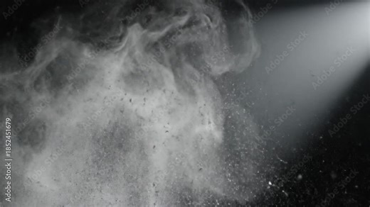 Explosion Of White Powder And Dust Particles Captured In Dramatic Lighting With Dark Background In Studio Environment
