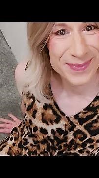 crossdresser Leah models a leopard print summer dress