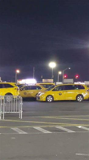 New York City Yellow Cabs Waiting area at JFK International Airport Queens New York USA.