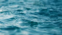 Close-up view of flickering ocean waves in slow motion, seamless loop...