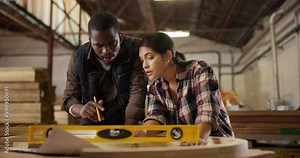 Carpenters, level and pencil with measurement for construction, furniture or project. People, partners and discussing with tools in a creative carpentry workshop for manufacturing, art and craft