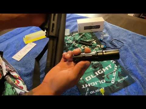 Olight Odin Mini installed on m lock Mossberg 590 Shockwave