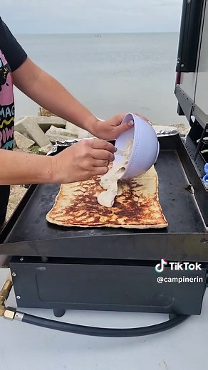 This is an easy camping recipe for breakfast pizza on the Blackstone. As you probably know, I use this griddle at least once a day on every camping trip. I love cooking outside of the camper. Being on a perfect campsite never hurts either! And easy meals are my favorite kind. What do you like to cook when you travel in your RV? #blackstonerecipe #blackstonegriddle #blackstonecooking #breakfastrecipes #campingrecipes #campingmeals #campcooking #cookout #campingfood #rvcooking #rvlife #rvliving #r