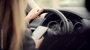 Checking Email Chats And Reading News.Female Writing Message In Vehicle On Social Network Chats On Cellphone.Texting And Driving Car On Social Media.Woman Texting On Smartphone While Driving Car.
