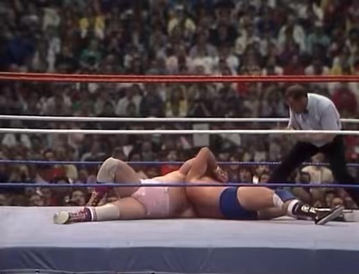 On March 29, 1987 WrestleMania III took place in front of 93,173 fans at the Pontiac Silverdome in Pontiac, Michigan and had almost 1 million fans watching the event at 160 closed-circuit locations in North America. In a “Hair vs. Hair” match, “Rowdy” Roddy Piper defeated “Adorable” Adrian Adonis (with Jimmy Hart) by submission. Billed as Piper’s retirement match, he went on to film Hell Comes to Frogtown and They Live and made sporadic appearances on television before finally returning to host