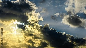 The sun's rays shone through the dark clouds. 4k sky cloud time lapse.