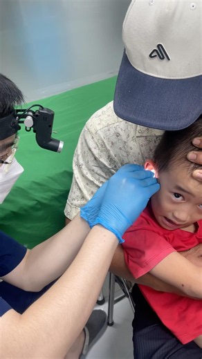 The child goes to the doctor for an ear examination