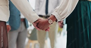 Business people, holding hands and meeting with team for unity, collaboration or support group at office. Closeup of employees touching for love, care or trust together in diversity at the workplace