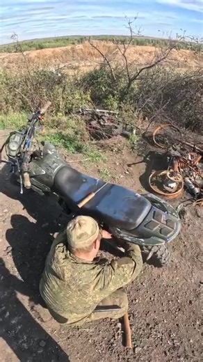 GoPro footage of a Russian Armed Forces soldier on a motorbike stopping to help a fellow soldier trying to repair his bike with pieces from previously destroyed motorbikes abandoned or destroyed along the roadside. (Like, Comment, Subscribe) #Russia🇷🇺 #RussianFederation #RussianArmedForces #ArmedForcesOfRussia #Comrades