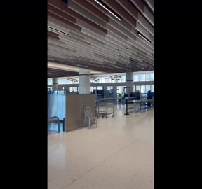 Travelers unfazed during fire alarm at San Diego International Airport, California, USA