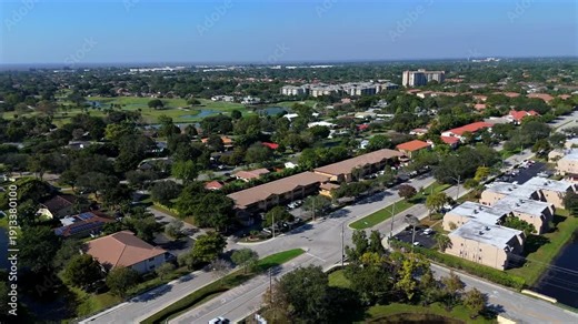 360 aerial panorama of Coral Springs Florida suburbs parks roads and trees