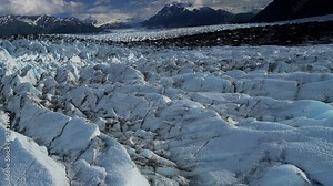 Aerial view Knik Glacier moraine crevasses feeding the Knik River, Alaska, USA
