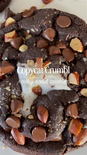 All the best parts of Rocky Road… baked into one thick, fudgy cookie.🤎 Rich chocolate dough marbled with gooey marshmallows, melty chocolate chips, and crunchy almonds in every bite. Soft centers and bakery-style edges. This recipe is a Crumbl copycat and the kind of cookies people ask you to make again and again. 😍 Recipe link in comments! Cooking with Karli Recipe can also be found on page 148 of my cookbook, Cookies for Days 💕 rocky road cookies | chocolate cookies | fudgy cookies | crumbl