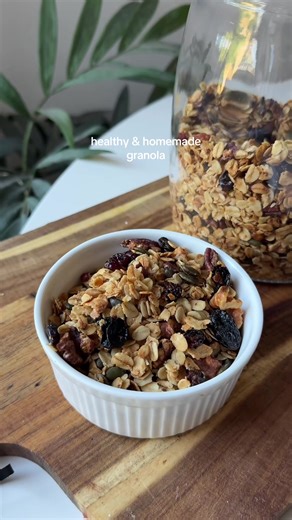 No more buying your granola at the shop!!! This is a much healthier & affordable way of making your yummy yog bowl addition... Ingredients (makes 18 servings - 40g per serving): 360 g old-fashioned rolled oats 50g pecans, chopped 50g walnuts, chopped 40g pumpkin seeds Tsp flakey sea salt 1/2 tsp ground cinnamon 100ml melted coconut oil 120 ml maple syrup or honey 90g dried fruit Method 1. Preheat oven to 190 degrees celsius and line a large, rimmed tray with baking paper. 2. In a large mixing bo