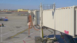 Airplane Jet Bridge at the Airport: Connecting Passengers to Their Flights in 4k slow motion 60fps