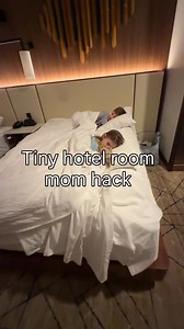 How we survived a tiny hotel room with kids. I always unpack the first night and keep everything very organized. I have one rule. I’m the only one allowed to lay out clothes or go through the drawers so I know exactly where everything is. And my kids don’t sleep head-to-toe. They sleep sideways across the bed 😅 I rolled up a towel and put it under the fitted sheet to create a soft boundary. You can also use towels as makeshift bed rails. They don’t need the full length of the bed, and this give