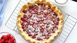 The perfect summer dessert in a pie. A layer of yummy custard topped with red raspberries. So simple and easy, but so delicious too. Make one for yourself, https://frugalfamilyhome.com/food/recipes/raspberry-custard-pie-recipe | Frugal Family Home | Facebook
