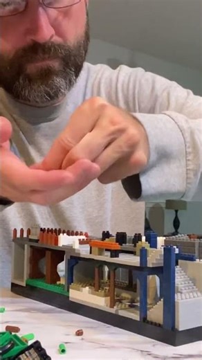 Adding a blue block, a gray stair, and a narrow blue brick.