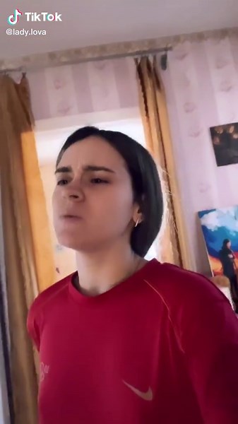 Dynamic Dance Moves in Red Nike T-Shirt