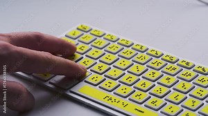 Blind person man hands using computer braille keyboard or terminal a technology assistive device for persons with disabilities. Palms moving tactile keys, creating text for visually impaired people. Stock Video
