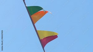 The ship's mast and signal flags close-up. Information flags of the ship are heard in the wind