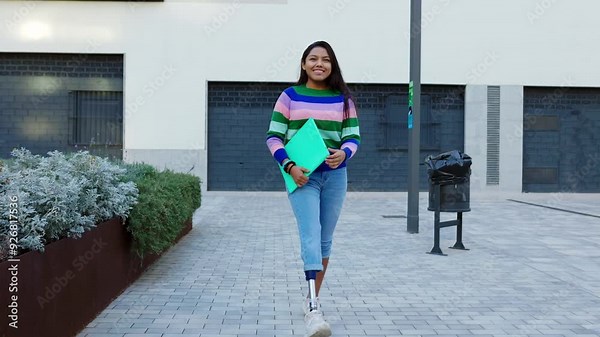 Young student woman with prosthetic leg meeting college friends at university campus. Education, diversity and youth community concept. Artificial limb.