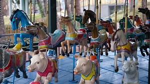 Carousel with horses by Herschell Spillman and pigs by Gustave Bayol