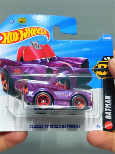Unboxing this Tooned Classic TV Series Batmobile from the Batman Series 2026. This is the seventh variant for this casting. This casting was designed by Ryu Asada and it made its debut in the 2022 Batman Series. This casting depicts a 'Tooned version of the Batmobile from the 1966 Batman television series and movie, featuring squished up & cartoonish proportions. Despite its size this casting is notably quite heavy with a centered weight distribution. Early prototype versions featured a loop log