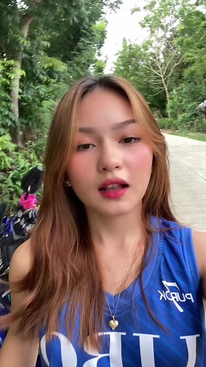 Riding a Blue Motorcycle Through Lush Greenery