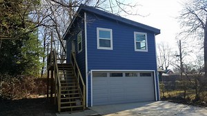 Two-Story Carriage House Kit with Garage Offers Versatile Options