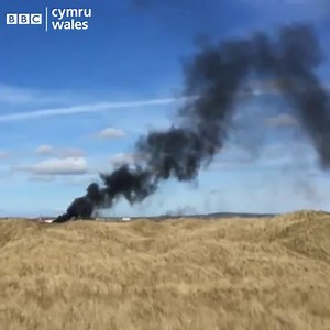 Black smoke seen at the site of a Red Arrows crash at RAF Valley on Anglesey Credit: Charles Round Full story: bbc.in/2u491R0 | BBC Wales News