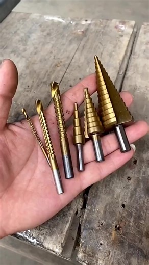 Step Drill Bit HSS Titanium Coated Features: 1.Made from high quality steel. 2.New Steel Large Step Cone Drill Titanium Bit Set Hole Cutter. 3.With the Titanium coated to reduce friction and heat. 4.Two flute design provides faster, smoother and cleaner cuts. 5.Suitable for using to cut holes in a variety of materials including steel, brass, wood, plastic, etc. #stepdrill #stepdrillbit #drillbit