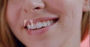 Woman, biting lip and mouth with teeth whitening and dental for health with beauty and grooming. Closeup of face, oral hygiene in studio for fresh breath and clean veneers with skin and shine