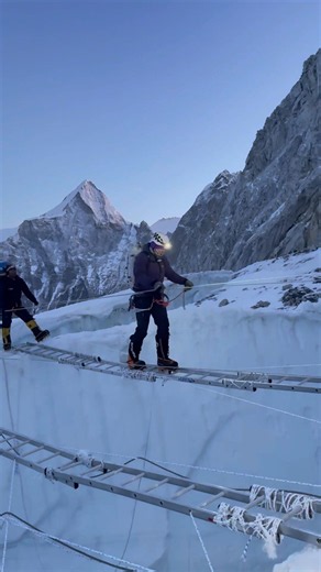 Everest ladder crossing over a deep crevasse in the Khumbu Icefall #mounteverest #everest