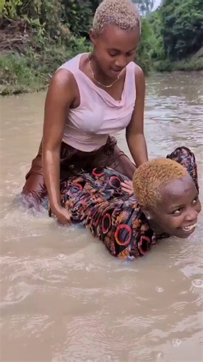 African women swimming and playing in the river