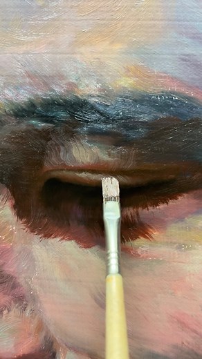 This oil painting close-up features a detailed view of an eye, showcasing a rich and expressive use of brushstrokes and colors. The eye is depicted in a half-closed state, conveying a sense of contemplation, fatigue, or introspection. Around the eye, I used shades of crimson, blue, and green, with touches of brown and black to add depth and dimension to the piece. Although this is a close-up, it doesn’t aim for hyper-realism but rather emphasizes emotional expression and visual impact. The conto