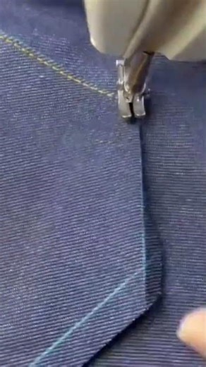 sewing jeans by sewing them using yellow thread by sewing them in order to