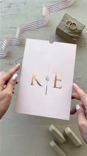 This transparent wedding invitation with gold foil detailing is the perfect blend of modern romance