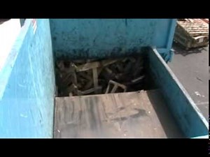 Blue Rhino Stationary Compactor crushing wood pallets.mpg