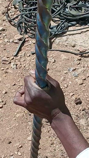 A Michaelsons Solar Technology's engineer preparing a market lighting project pole mounting hole