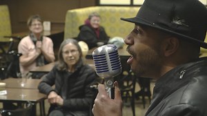 Grocery bagger by day, café crooner by night