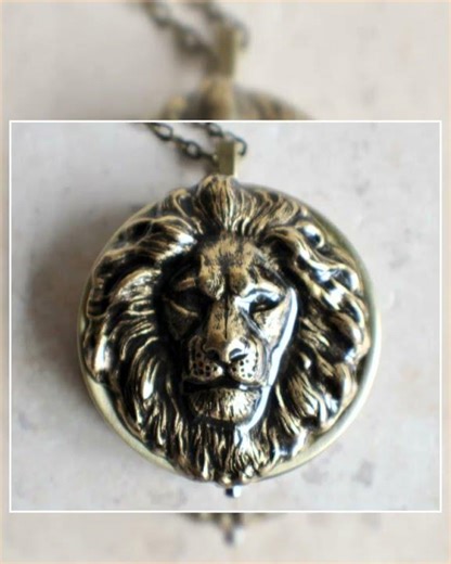 Lion music box locket, round locket with music box inside, in bronze with lion.