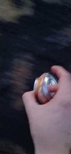 Sliding can across a rock sound effect