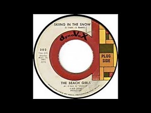 BEACH GIRLS SKIING IN THE SNOW