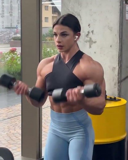 Sexy female bodybuilder's with huge muscular arms and shoulders workout - Stefana Sandu