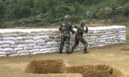 Chinese army recruit drops live grenade and is saved by instructor – video