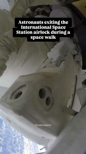 Astronauts on the International Space Station exiting an airlock during a space walk.